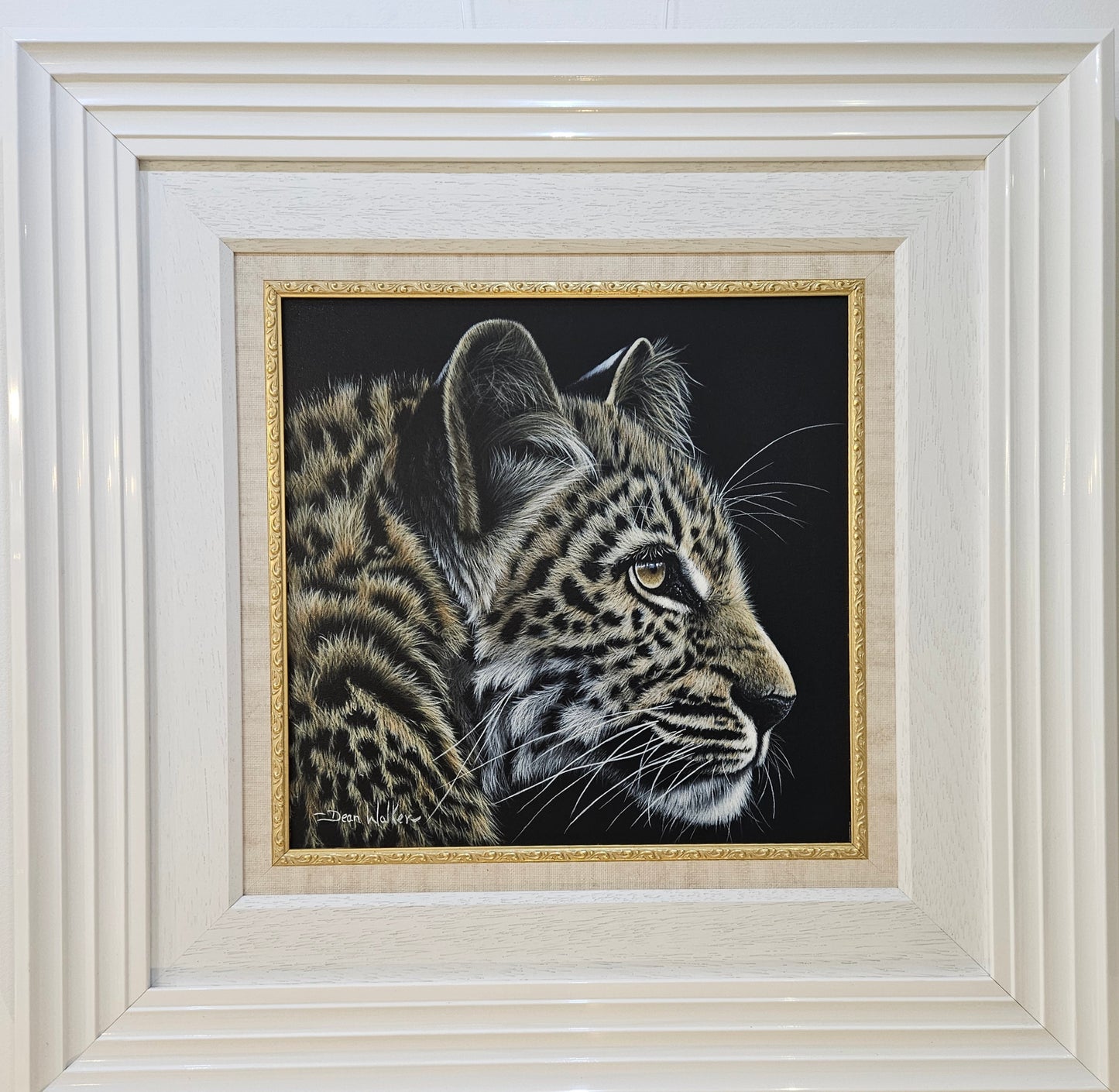 Leapard by Dean Walker - The leopard's fur is beautifully detailed, showcasing a variety of brown and black spots against a golden background