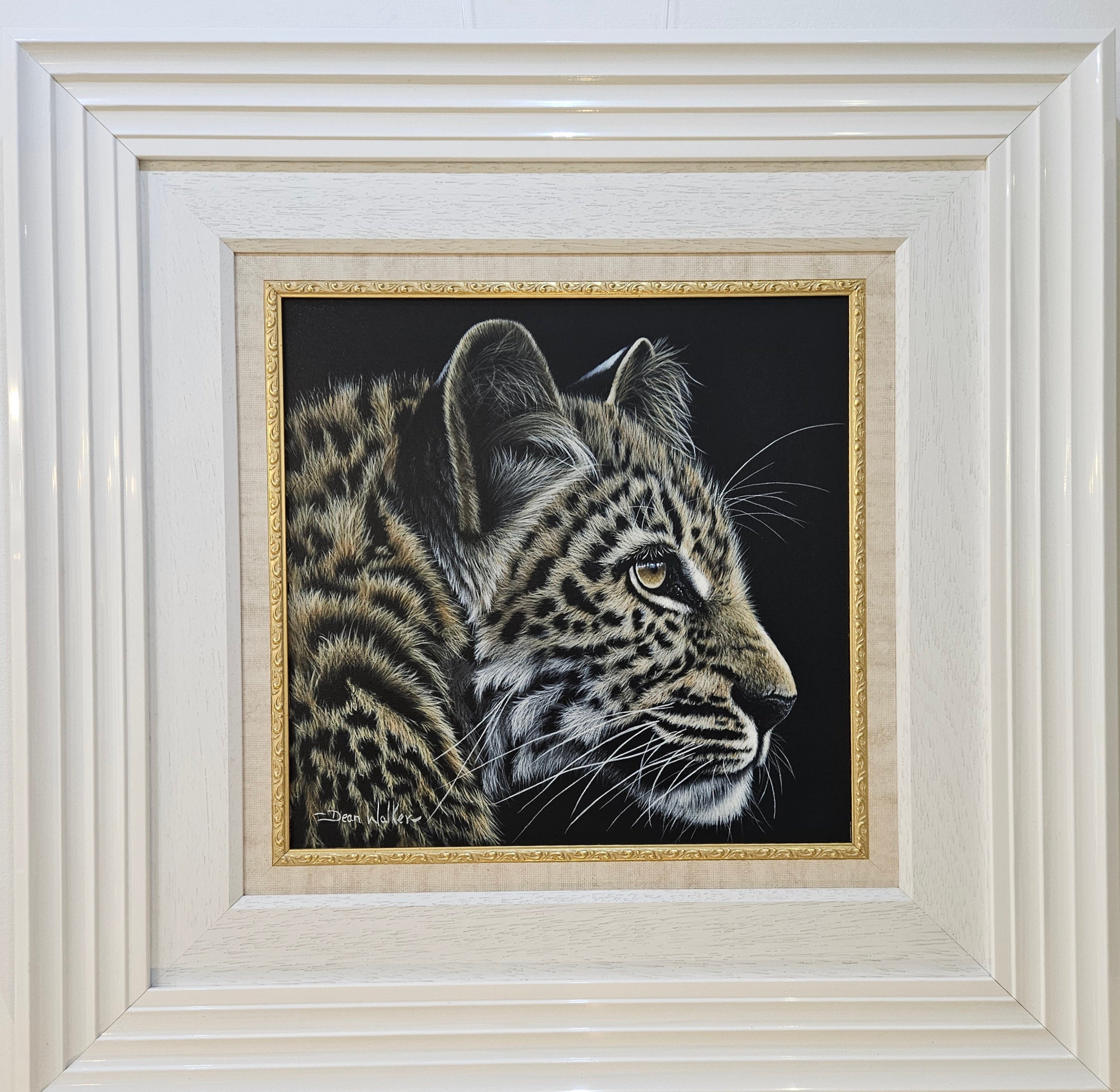 Leapard by Dean Walker - The leopard's fur is beautifully detailed, showcasing a variety of brown and black spots against a golden background