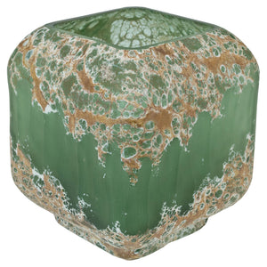 Green ceramic vase with marbled pattern on a green background