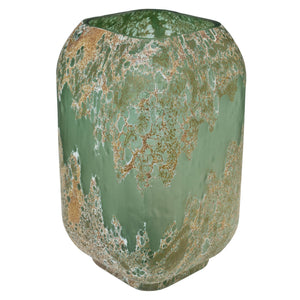 Green ceramic vase with marbled pattern on a green background